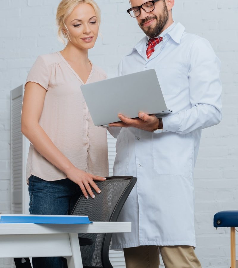 smiling-physiotherapist-in-white-coat-and-female-p-2022-11-01-23-18-06-utc-min.jpg